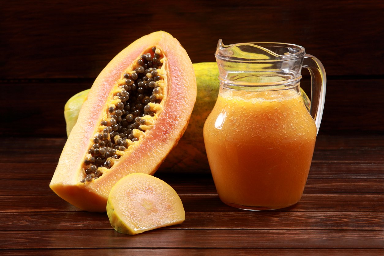 Fresh Ripe Papaya for Juice and Dessert on wood background