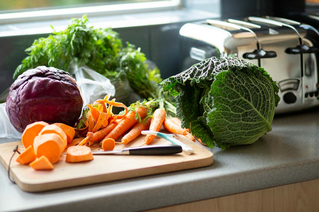 Nutrient-dense foods on counter ready for chopping