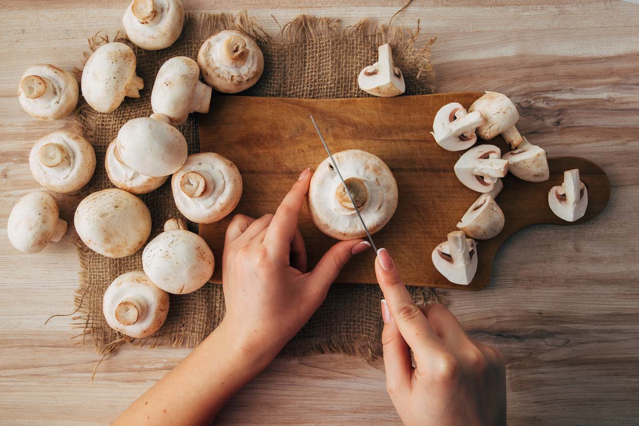 preparing mushrooms on cutting board