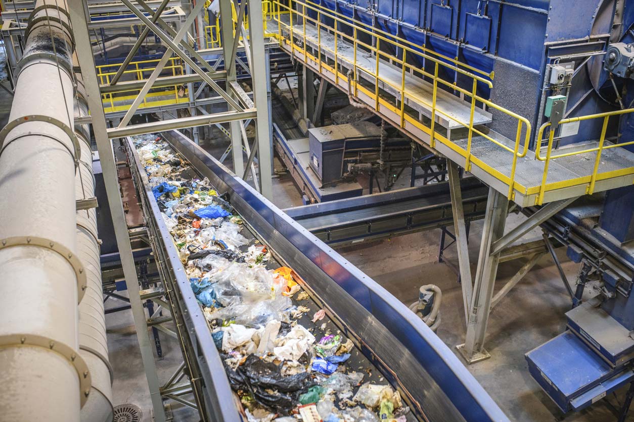 conveyor belt for recyclables in waste processing facility