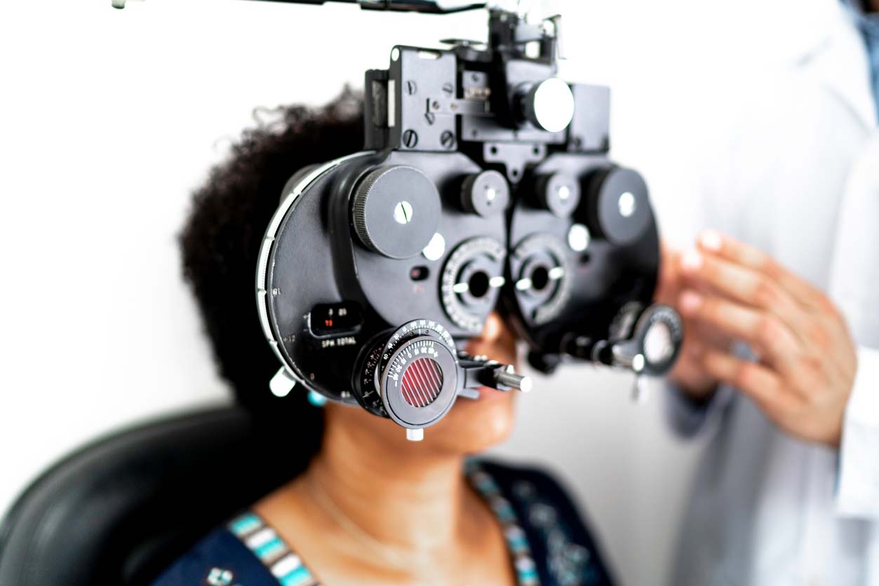 Woman getting her eyes checked at optometrist's office