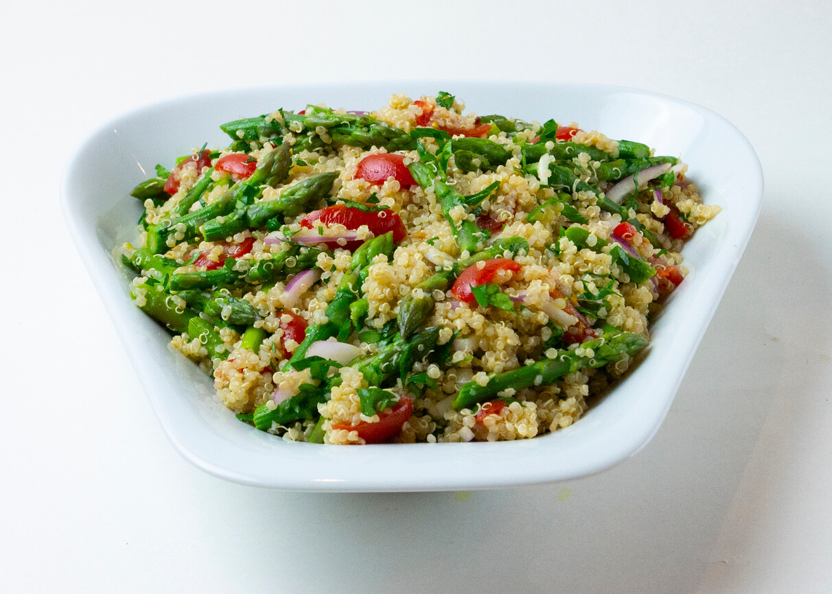 Quinoa salad with asparagus and parsley stock photo