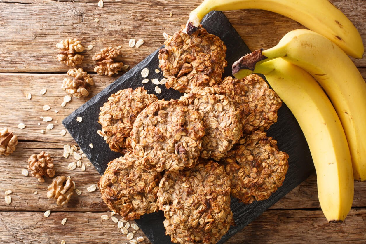 homemade-low-calorie-banana-cookies-with-oatmeal-and-walnuts-close-up-on-a-slate