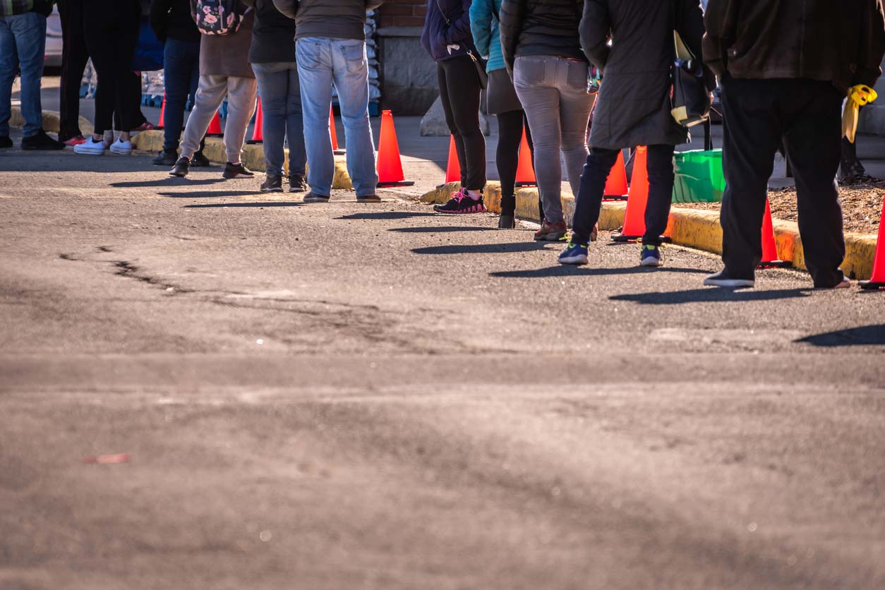 People waiting in line for food