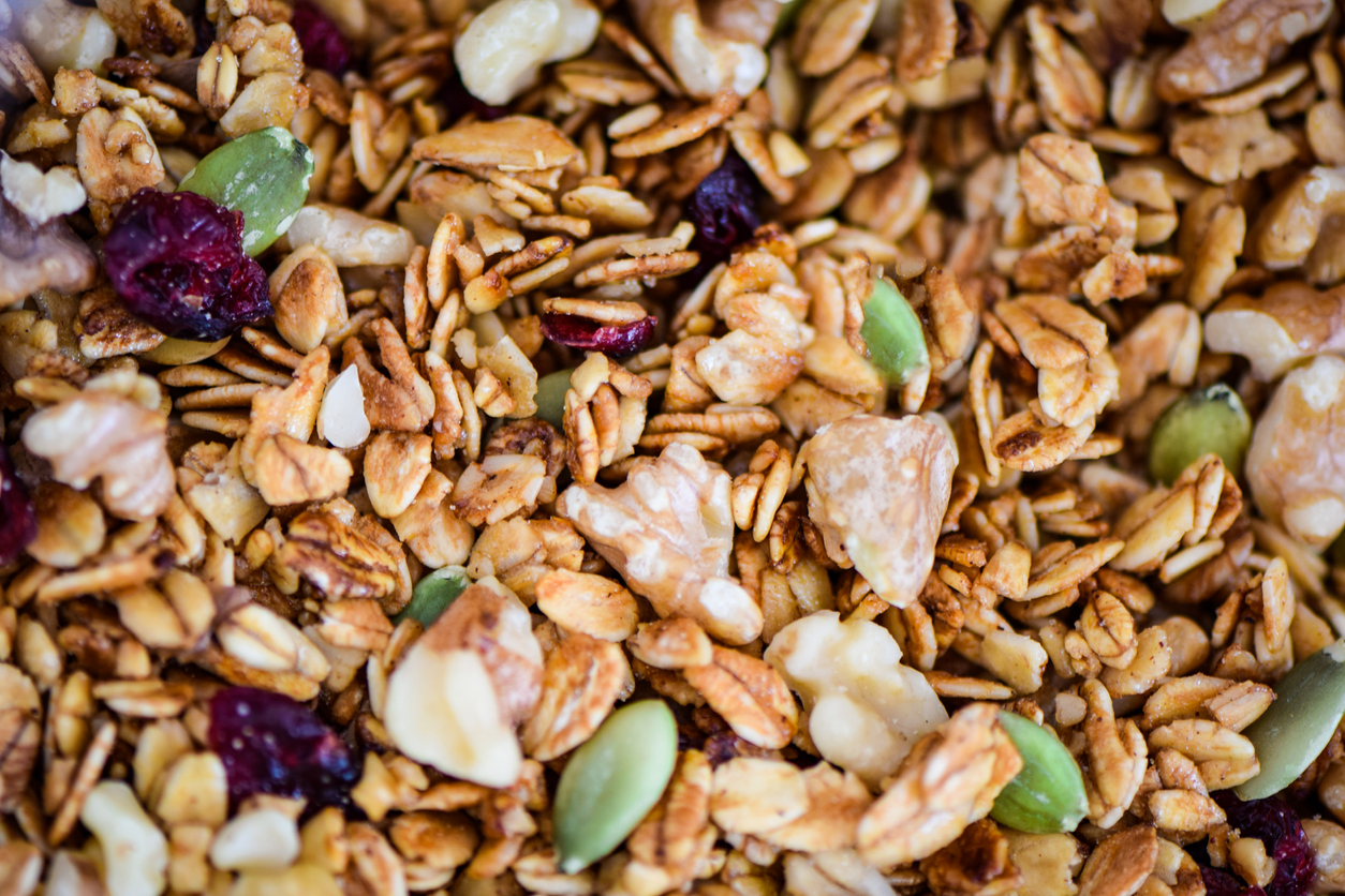 Toasted granola cereal with rolled oats, walnuts, dried cranberries and green pumpkin seeds.