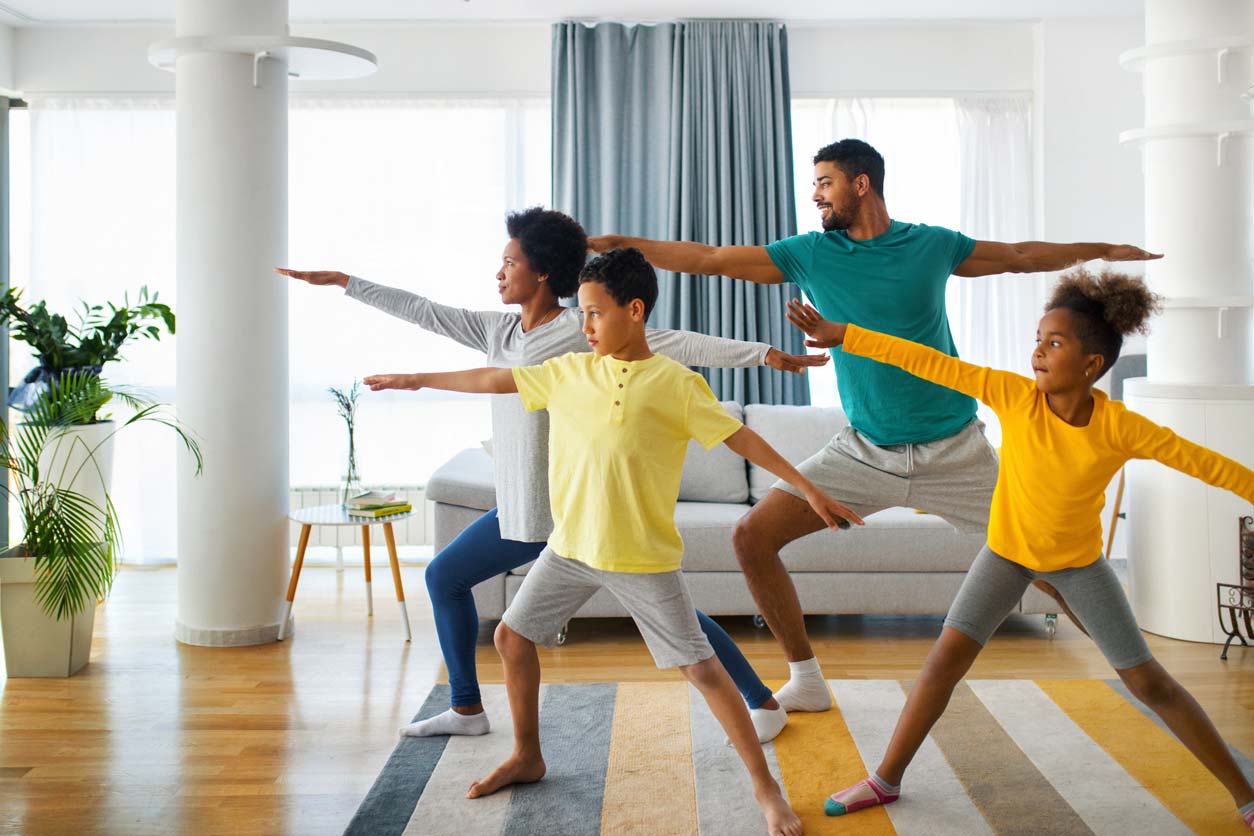 Family doing yoga to prevent osteoporosis