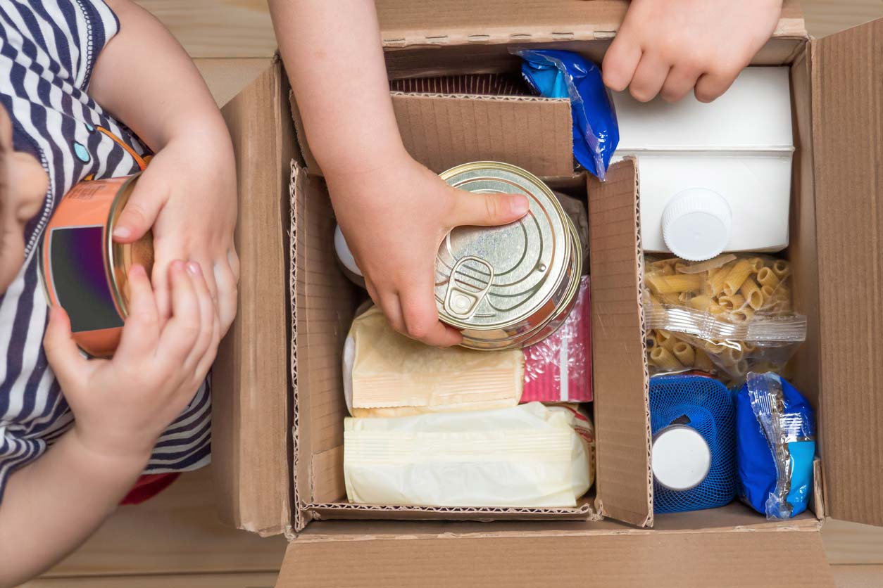 Children opening food box of food donations