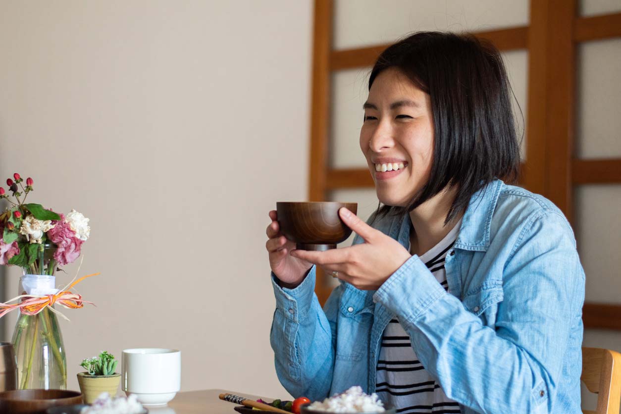 woman eating japanese style breakfast