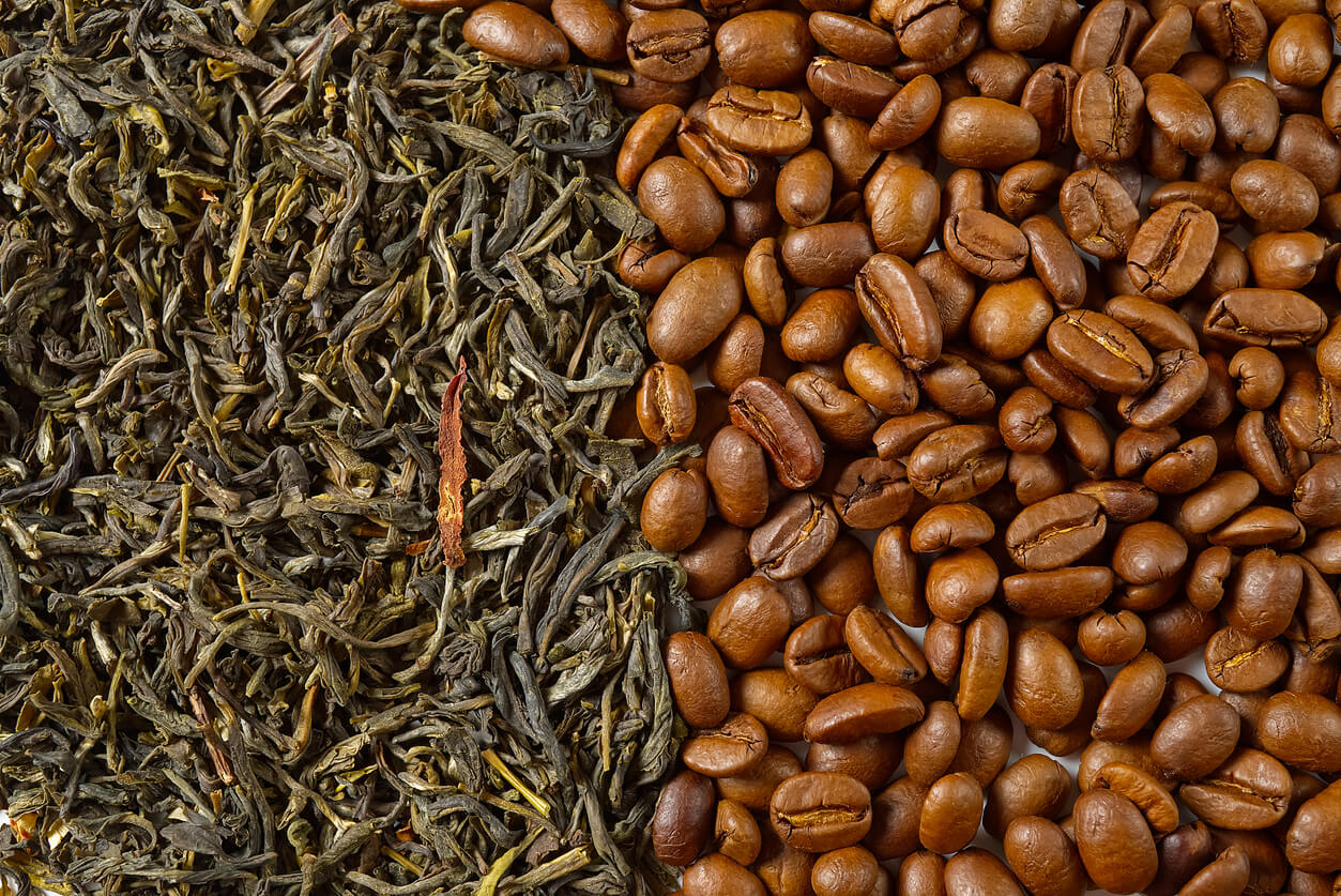 dry leaves of green tea and fine roasted coffee beans