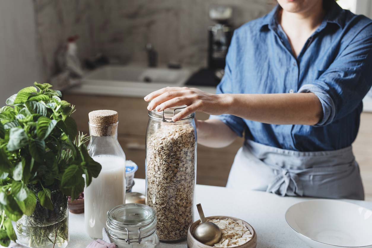 woman using rolled oats to make meal