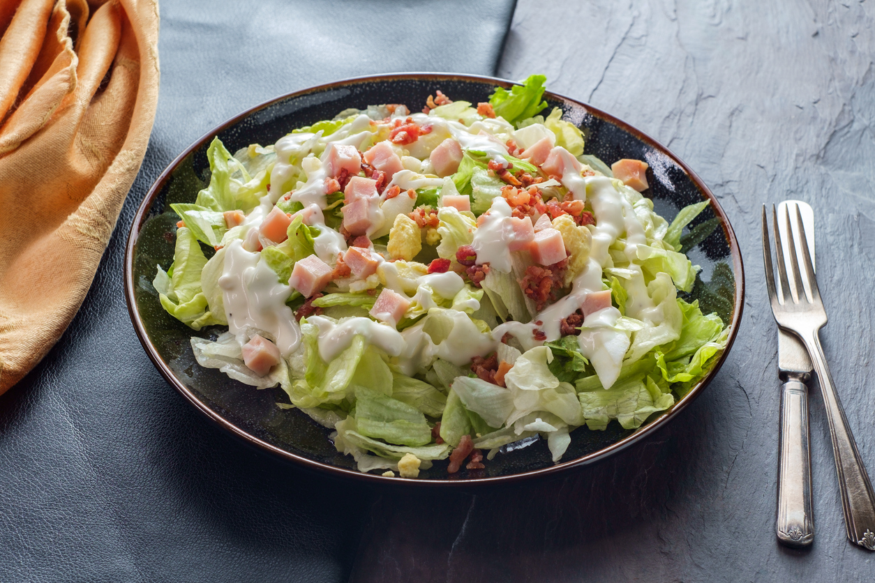 Garden Cobb salad with iceberg lettuce ham bacon and hardboiled eggs