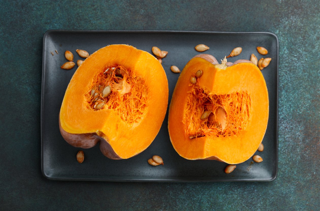 Pumpkin slices on textured green background