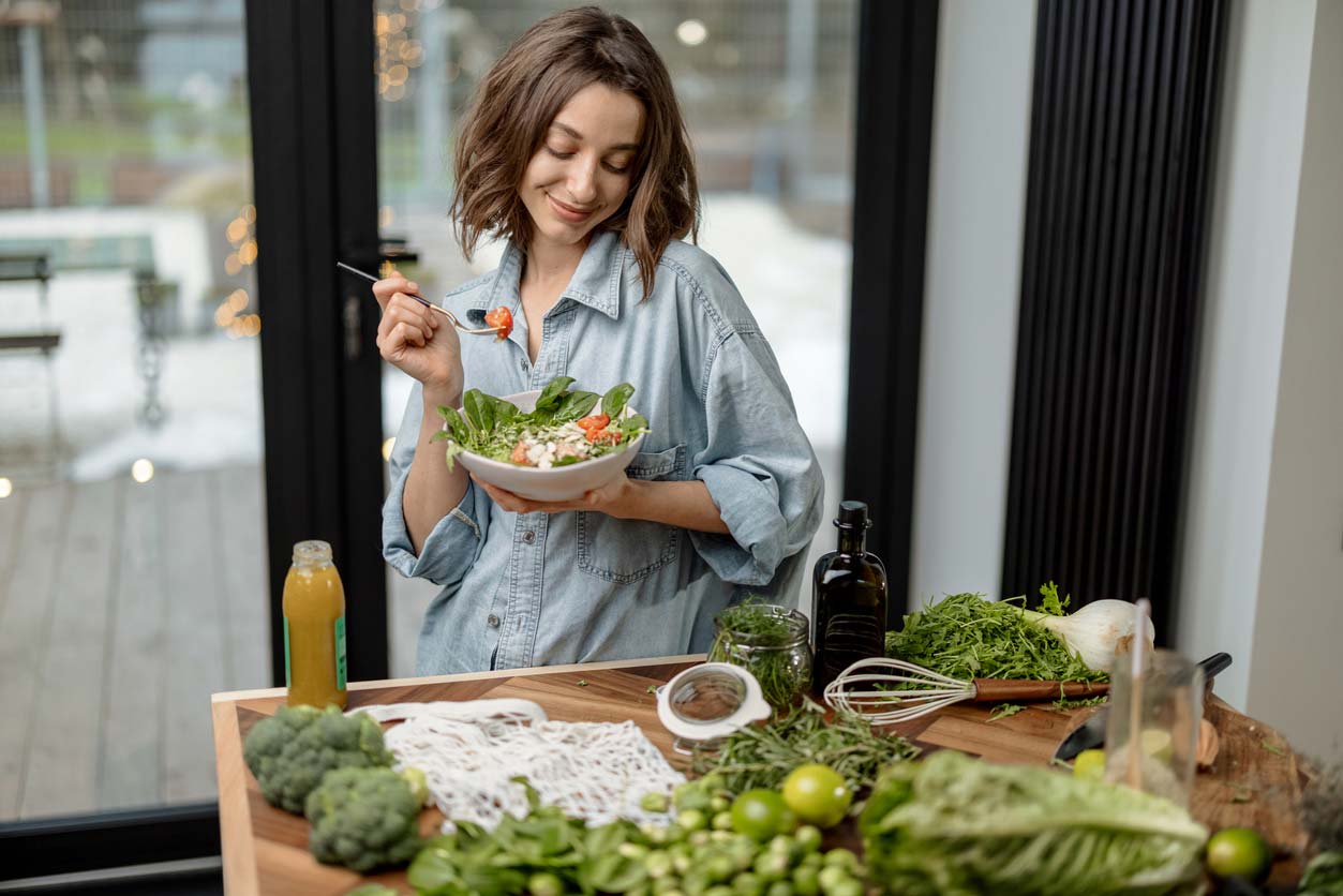 woman admiring her healthy salad recipe