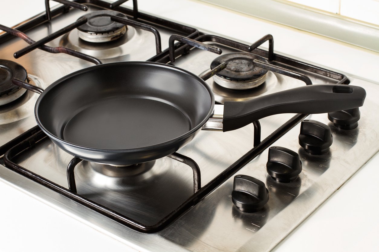 Frying pan on a gas kitchen in a close up view