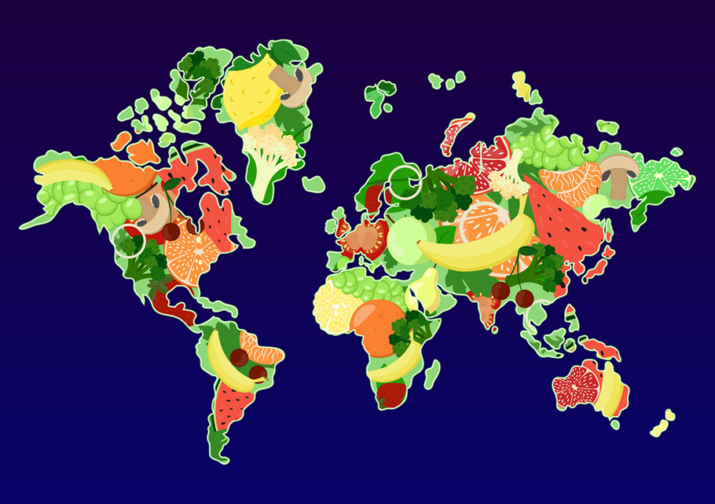 World map with fruits and vegetables.