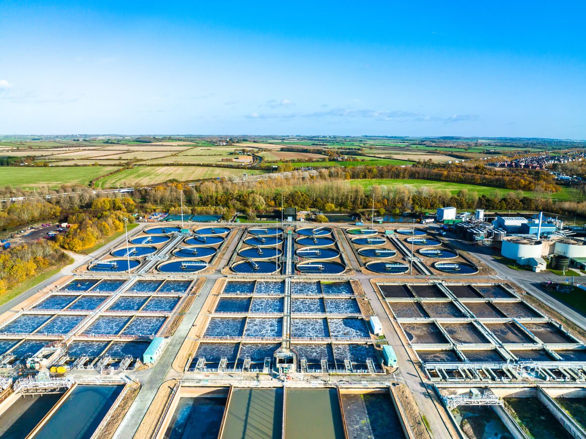 aerial photo of purification tanks of modern waste water treatment plant