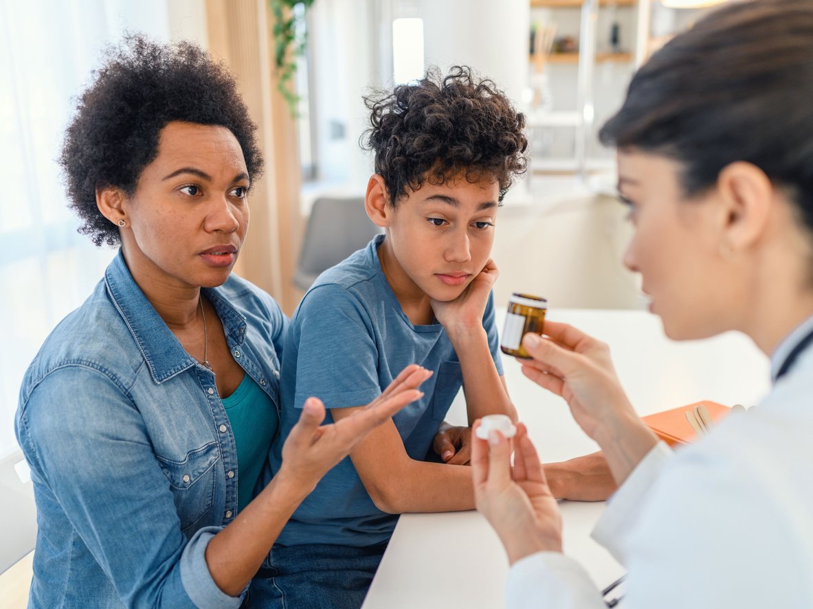 Doctor gives patient prescription medication