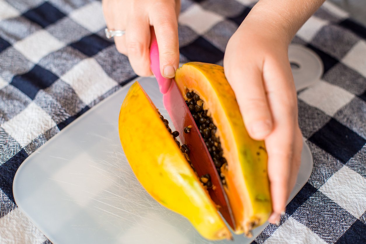 Half of ripe papaya fruit with seeds