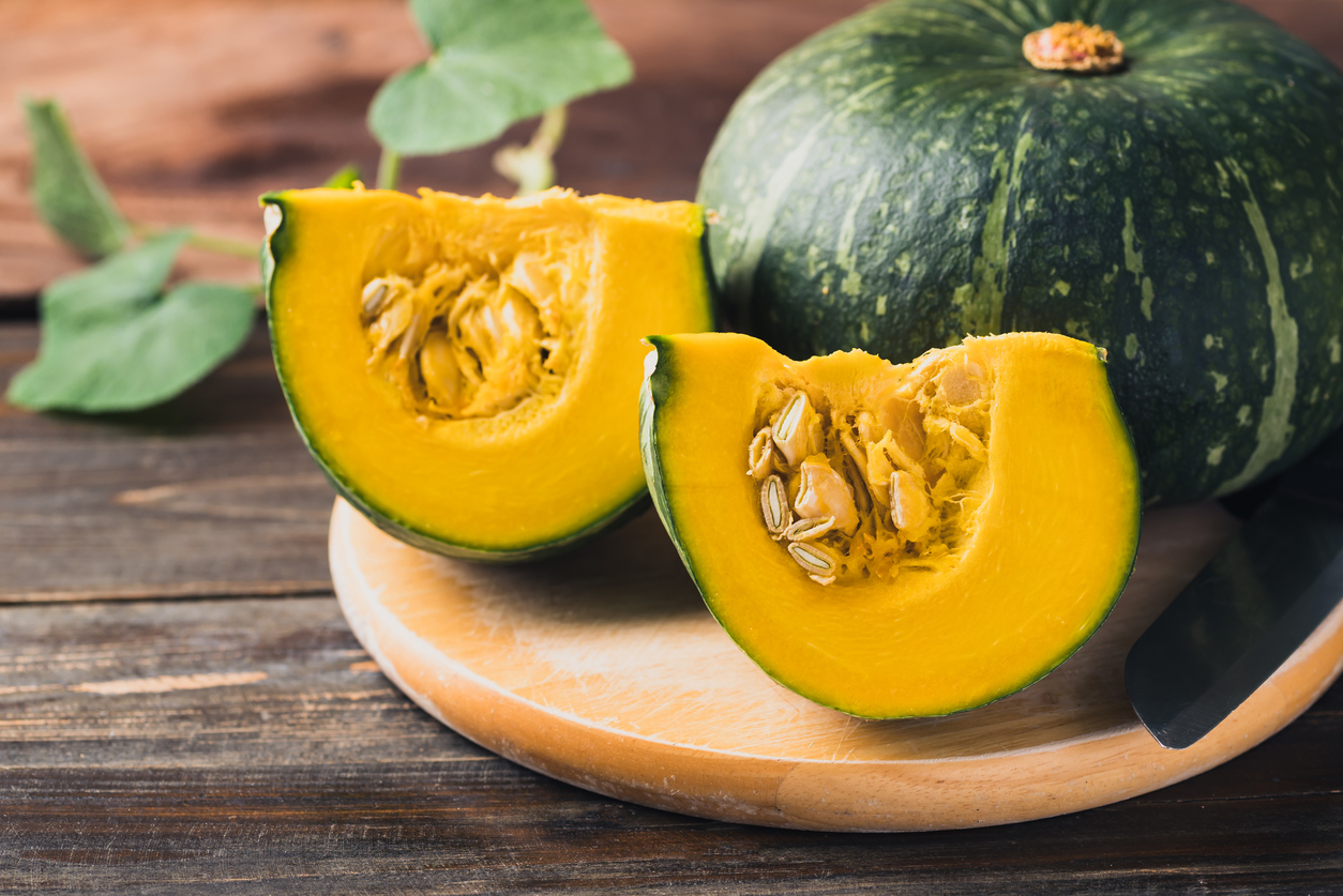 Green pumpkin on wooden background, Organic vegetable