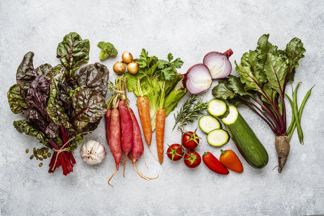 Overhead view of fresh healthy organic vegetables background. High resolution 42Mp studio digital capture taken with SONY A7rII and Zeiss Batis 40mm F2.0 CF lens