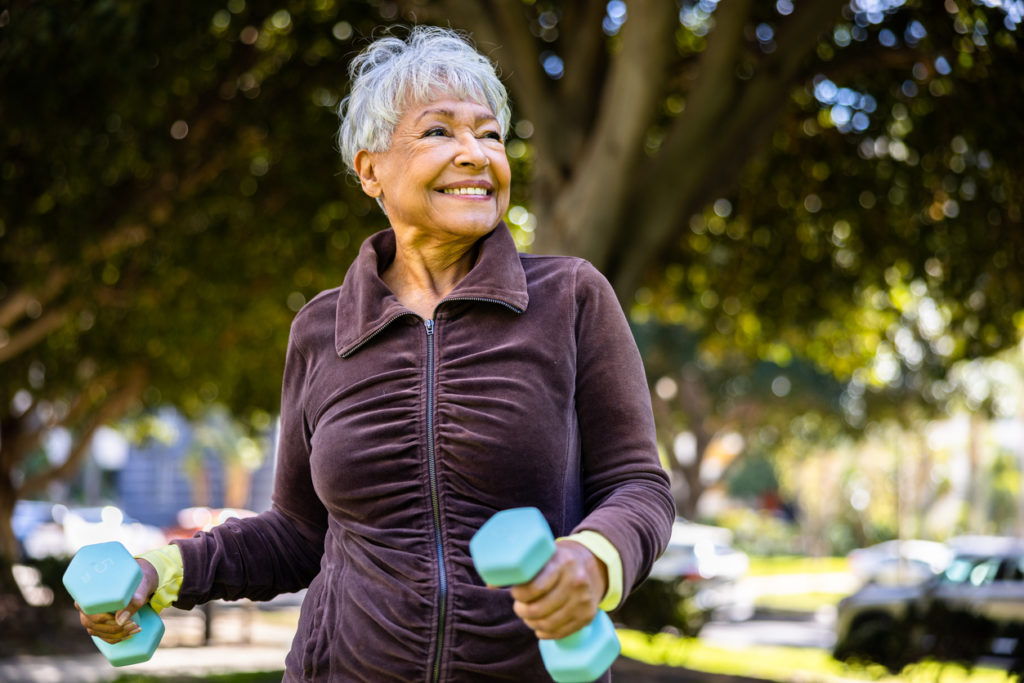 Older African American woman exercising outdoors