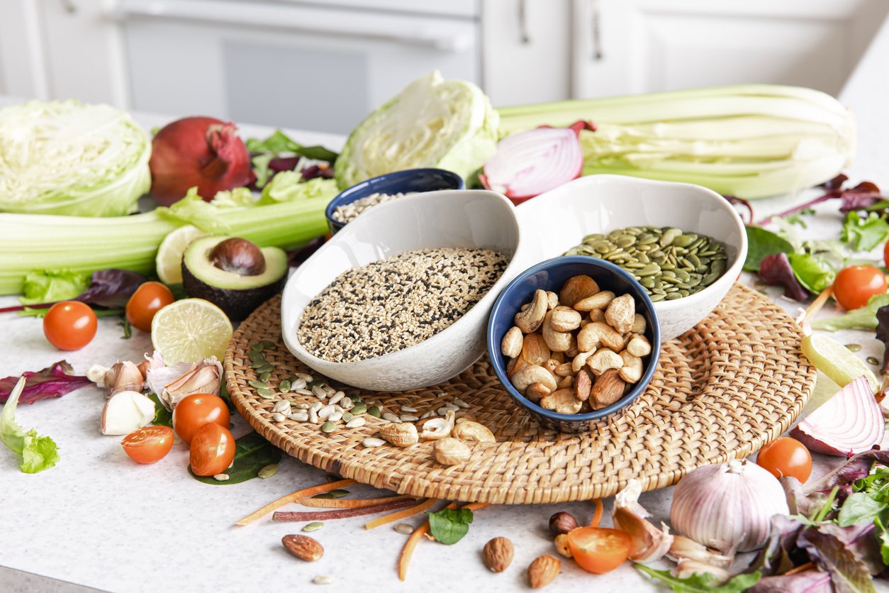 Close-up, bowl with white chia seeds and healthy vegetables on the kitchen table, healthy eating concept.