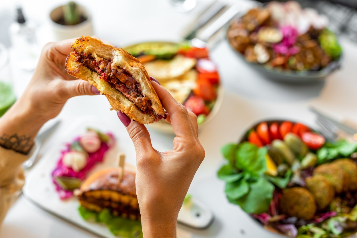 Woman eating vegan burger