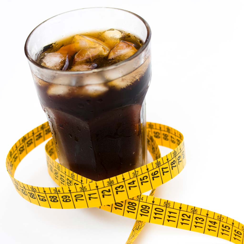 soda with measuring tape around it