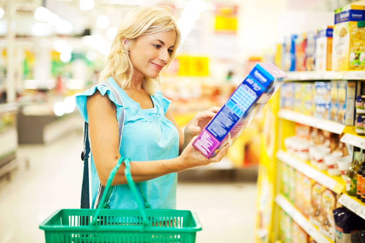 Woman shopping cereals.