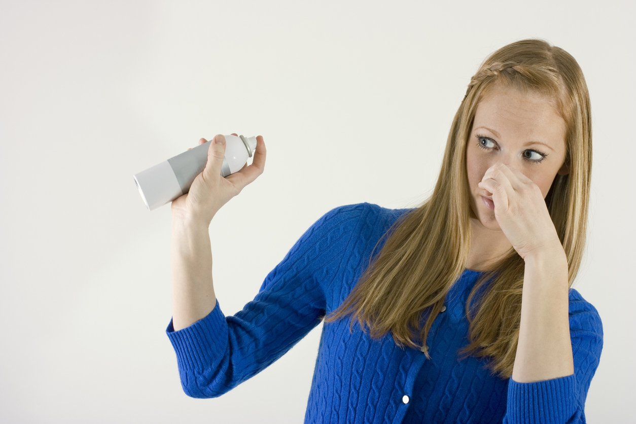 Covering up an odor with an air freshener.