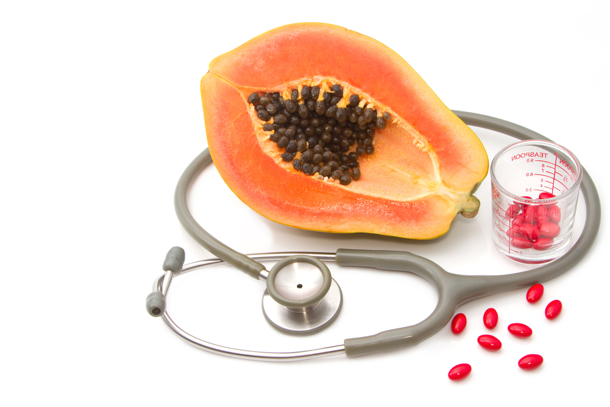 Pill and stethoscope with papaya fruit ,Vitamin supplement and nutrition concept