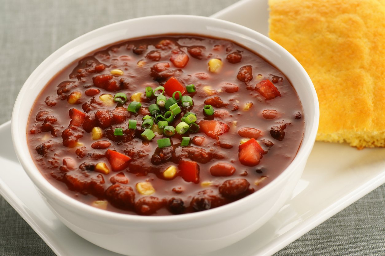 Bowl of Vegan Chili Soup with Cornbread