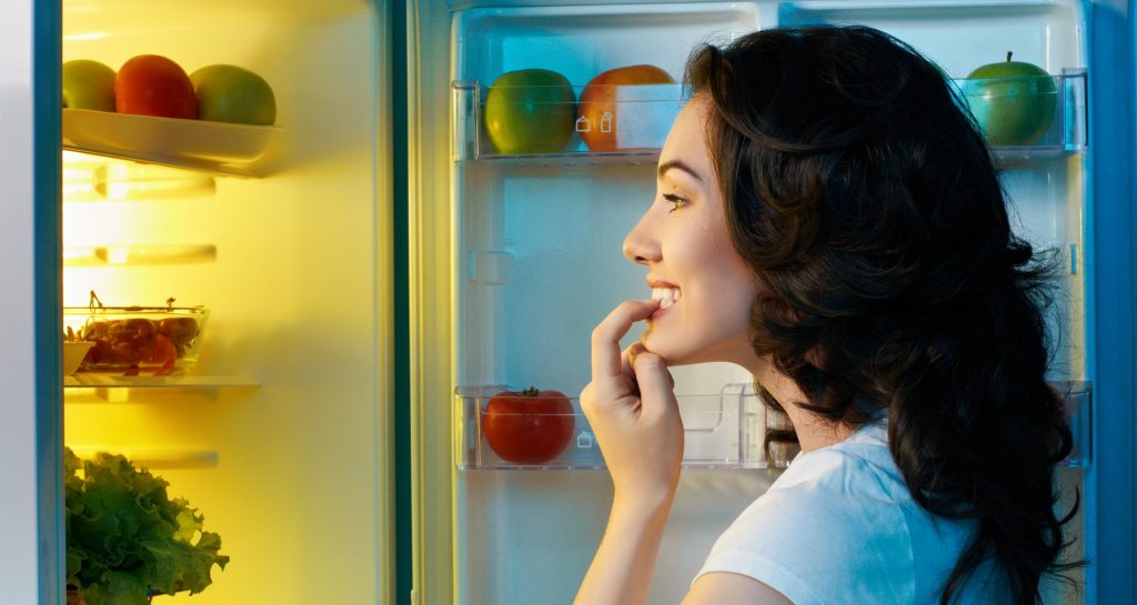 Woman looking in the refrigerator