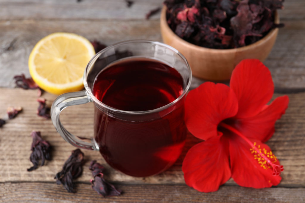 Hibiscus tea and flower on table