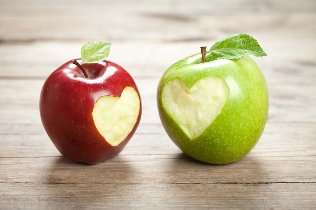 two apples with heart bites