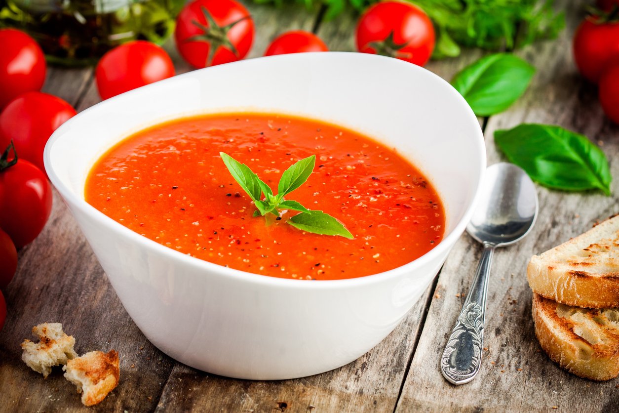 homemade vegetarian tomato cream soup ÑÑ white bowl on wooden table