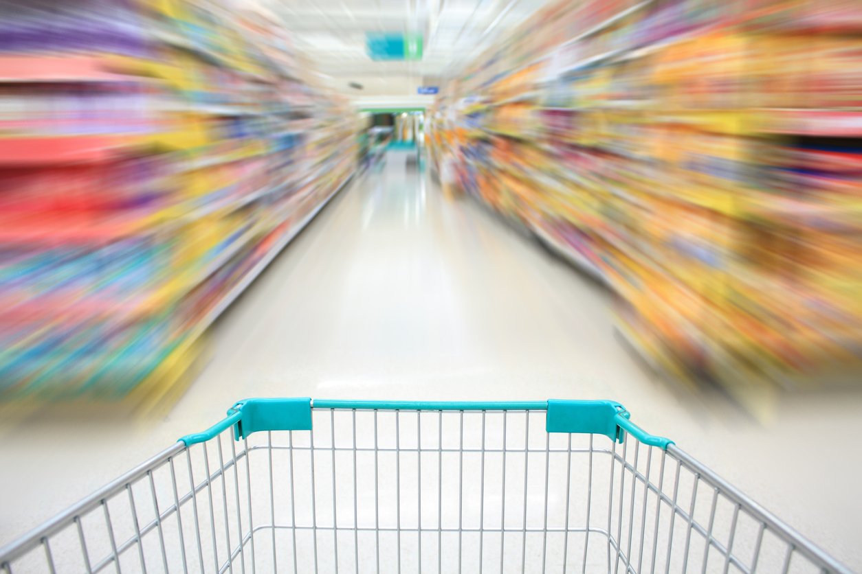 shopping in supermarket by supermarket cart