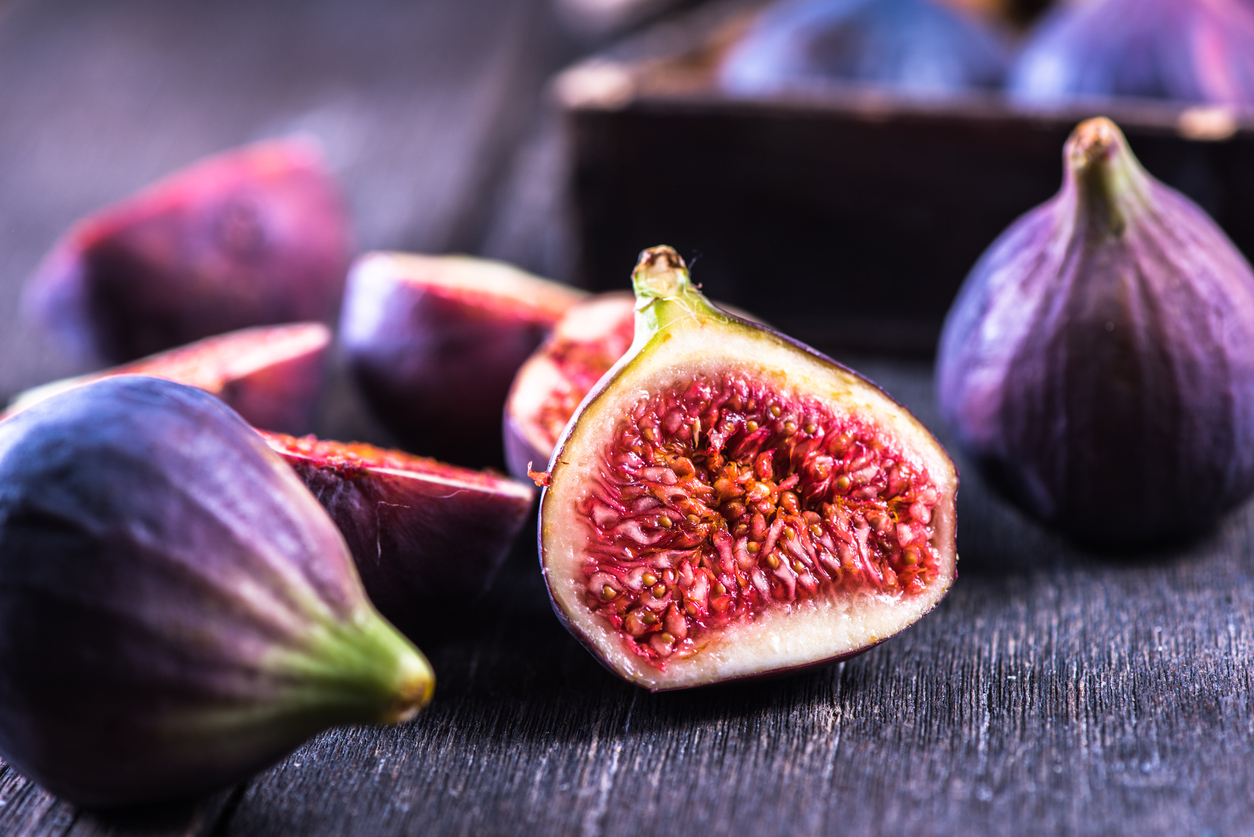 Whole and cut fresh vibrant figs fruit from above