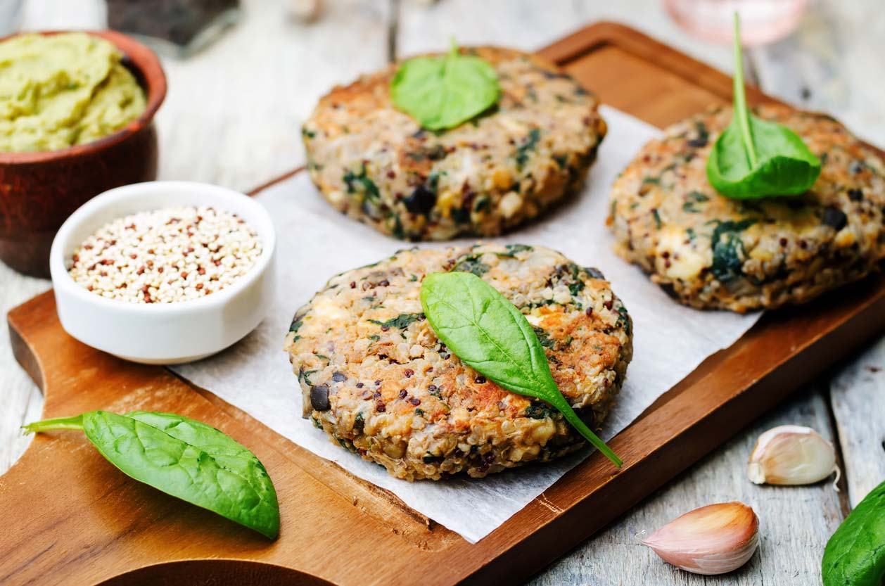 quinoa veggie burger patties on cutting board