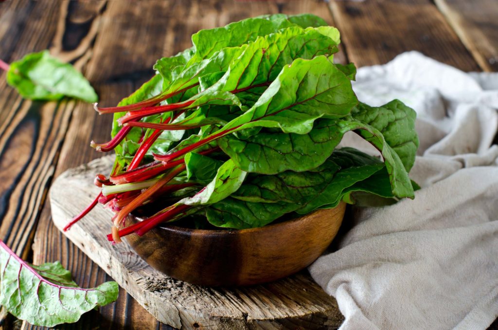 swiss chard in a bowl on a table