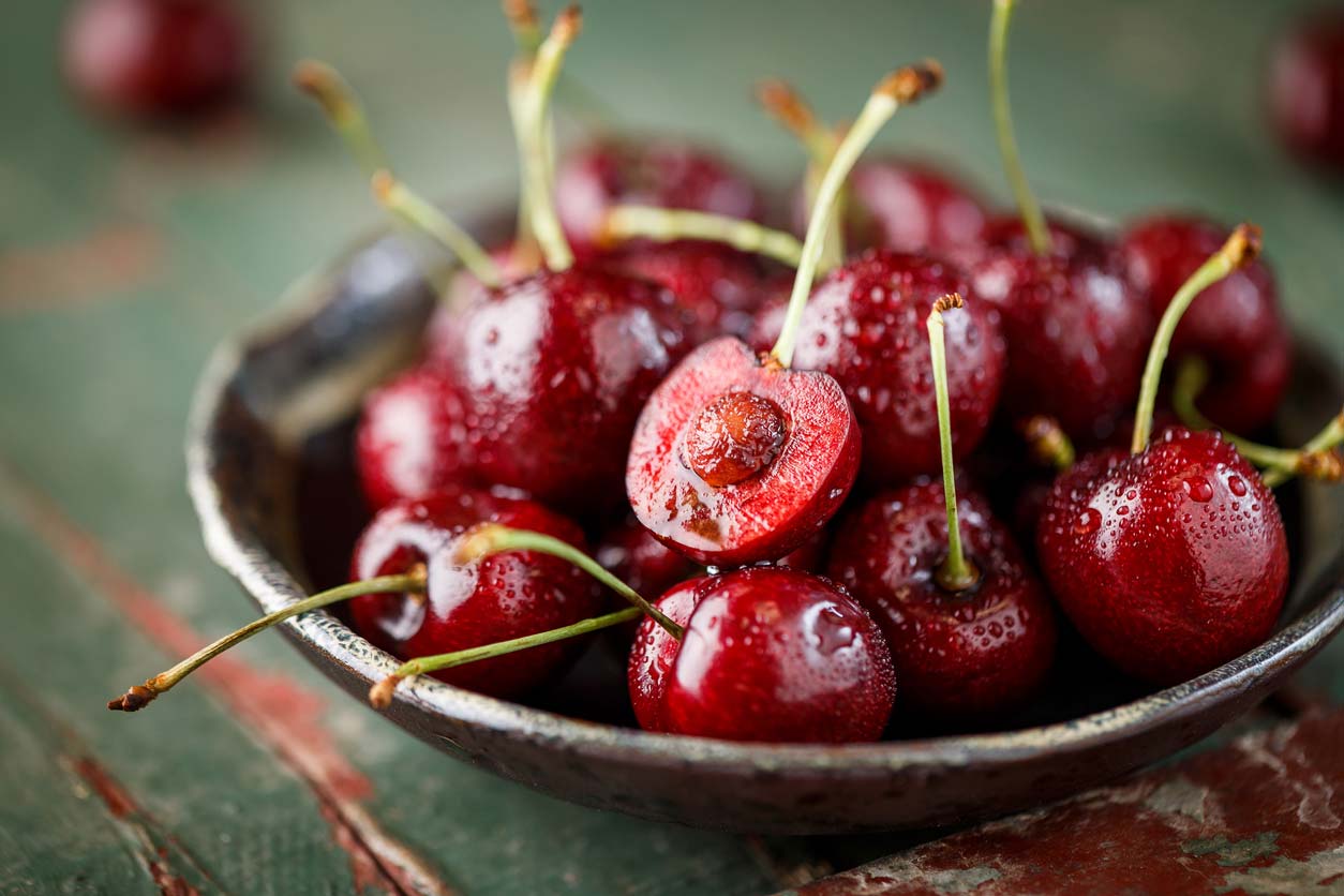 cherries in serving bowl with pit exposed