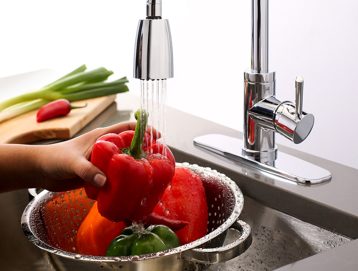 Washing vegetables in a sink