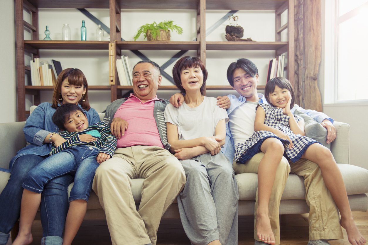 Multi-generation family relaxing at home