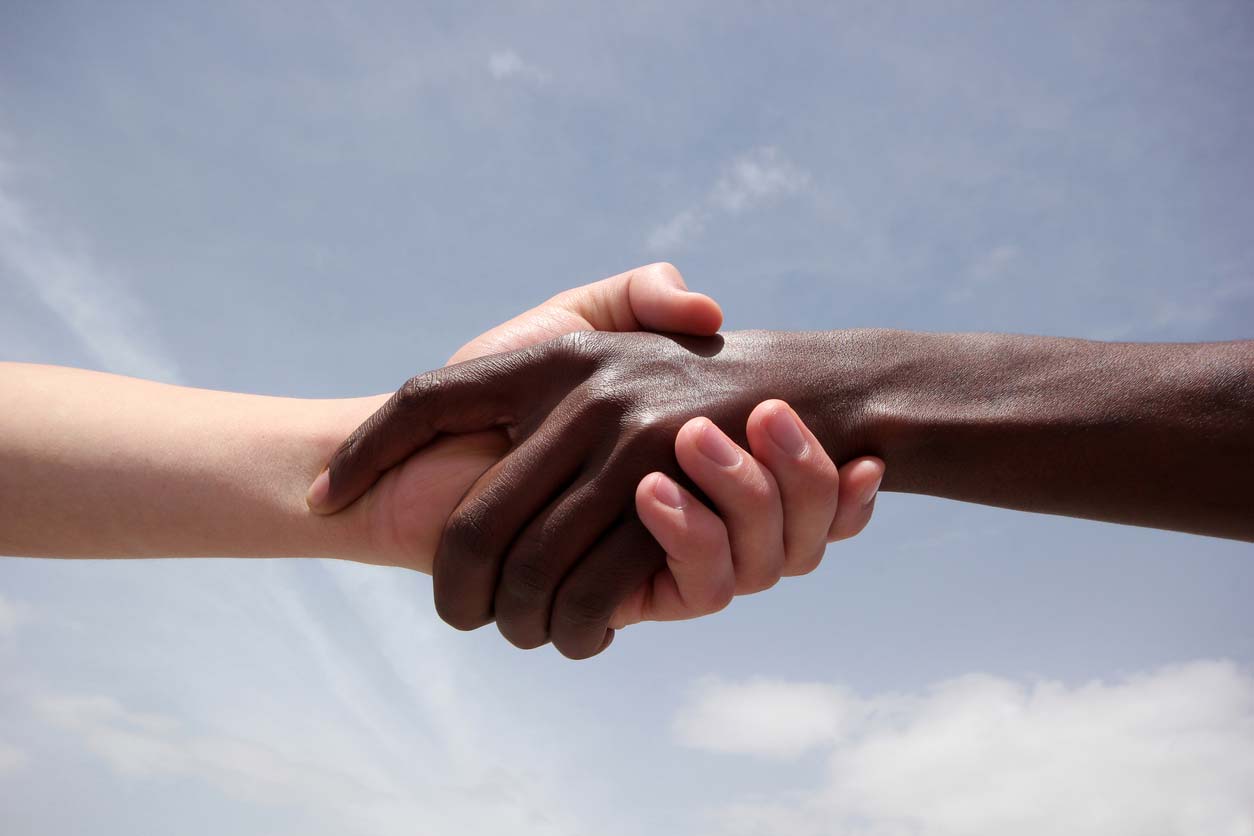 black and white human hands in handshake