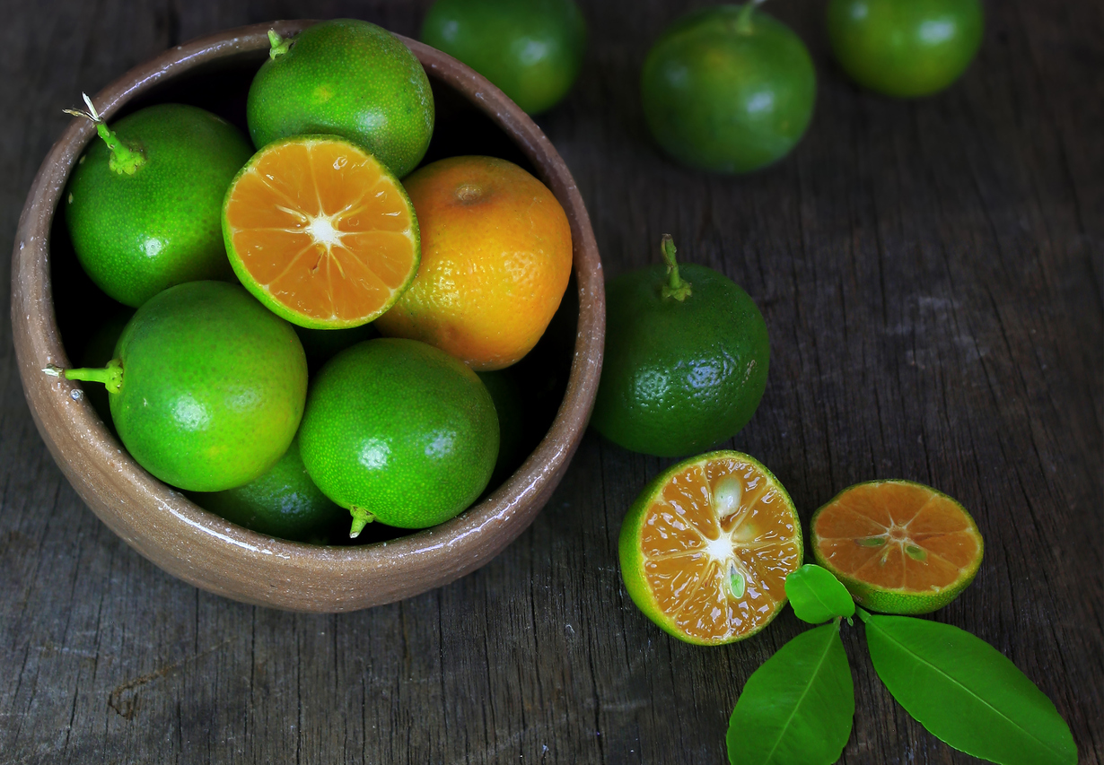 Fresh Citrus calamondin fruit on Wooden Background