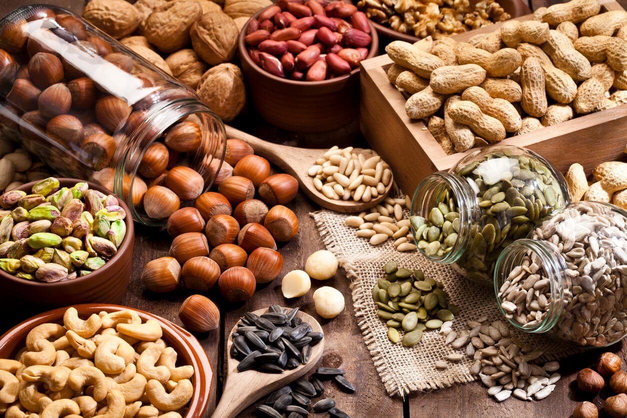 assortment of nuts on rustic wood table