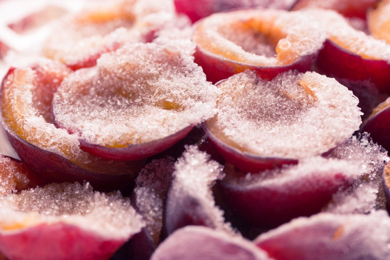 frozen plum on a wooden background