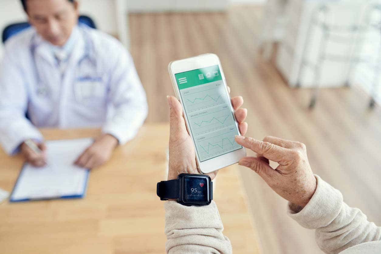 patient checking heart rate with health tracker