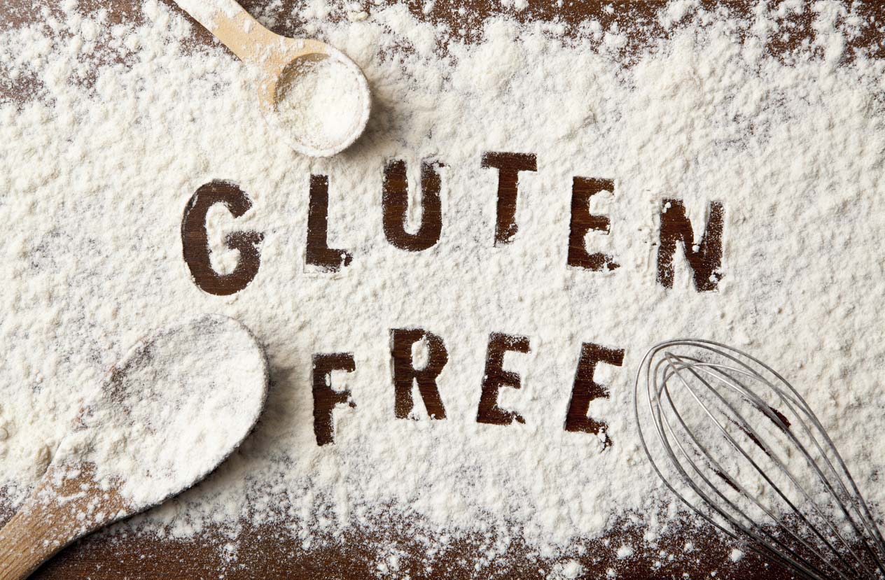 words gluten free written in flour on table