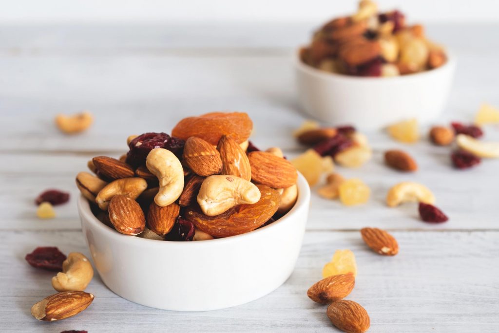 variety of nuts in small bowls